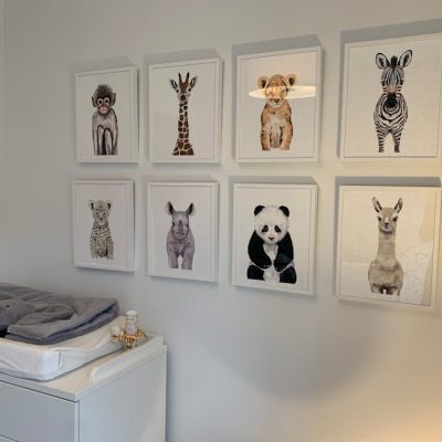 Adorable animal prints adding charm to a minimalist nursery wall decor.